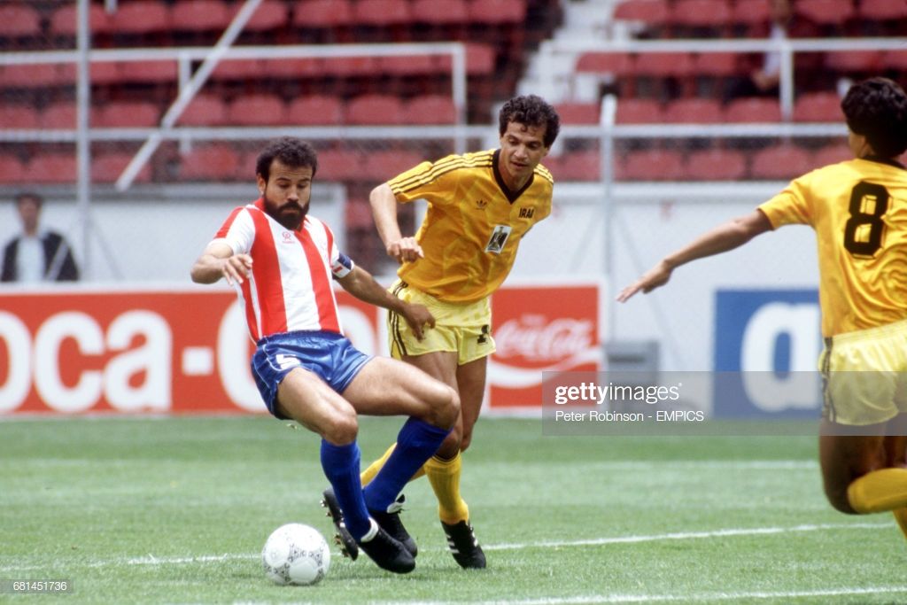 Paraguay's Rogelio Delgado is challenged by Iraq's Hussein Saeed